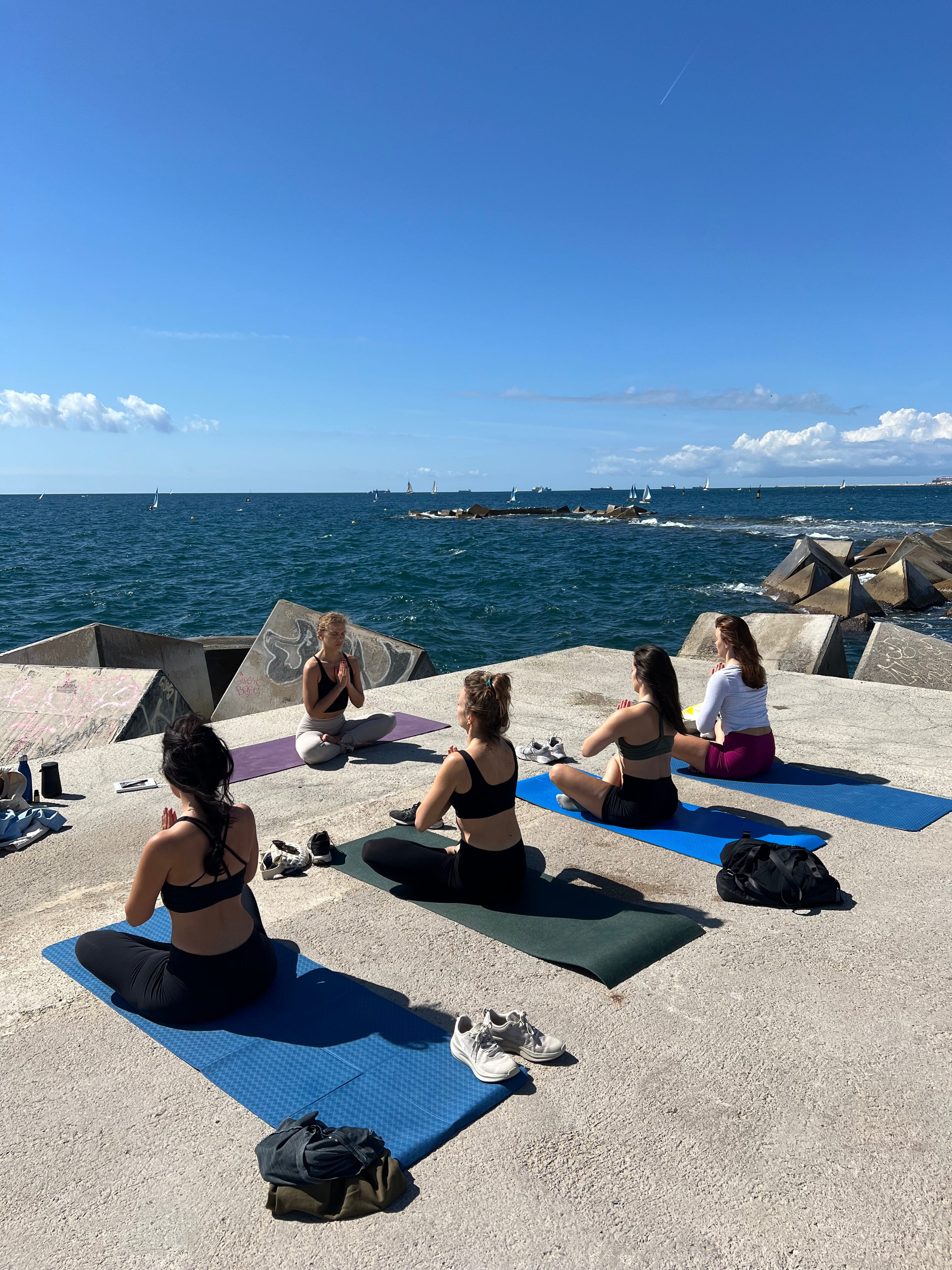 Seated meditation circle facing the open sea