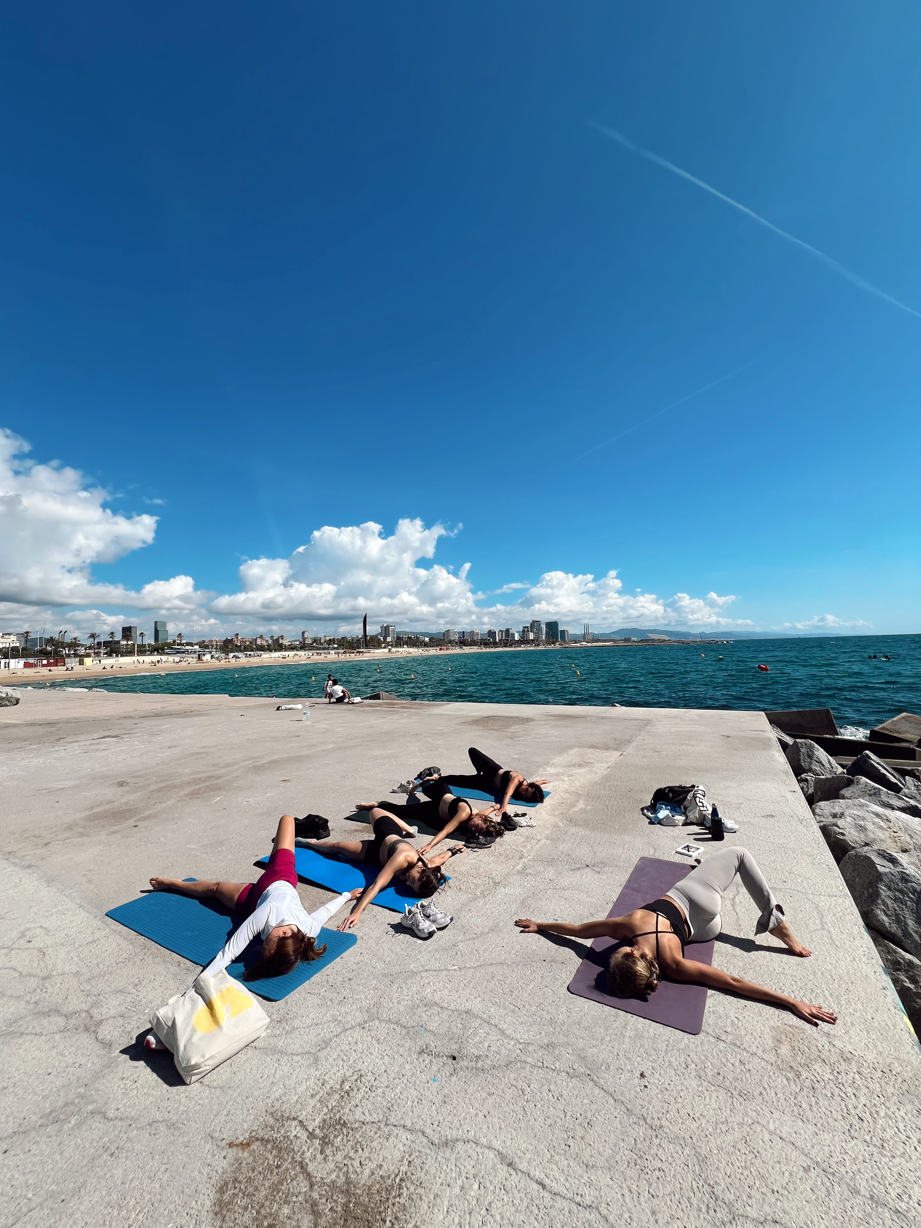 Reclined twist on the pier with the city in the distance